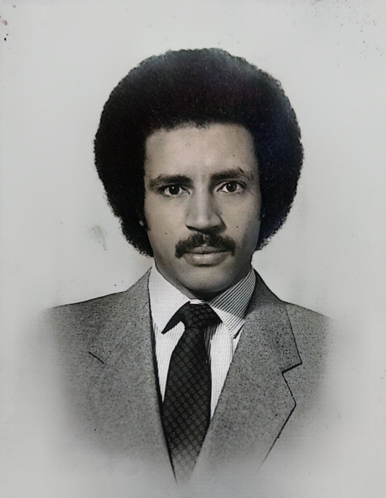 Black-and-white portrait of Dr. Worku Mekonnen as a young doctor in a suit and tie