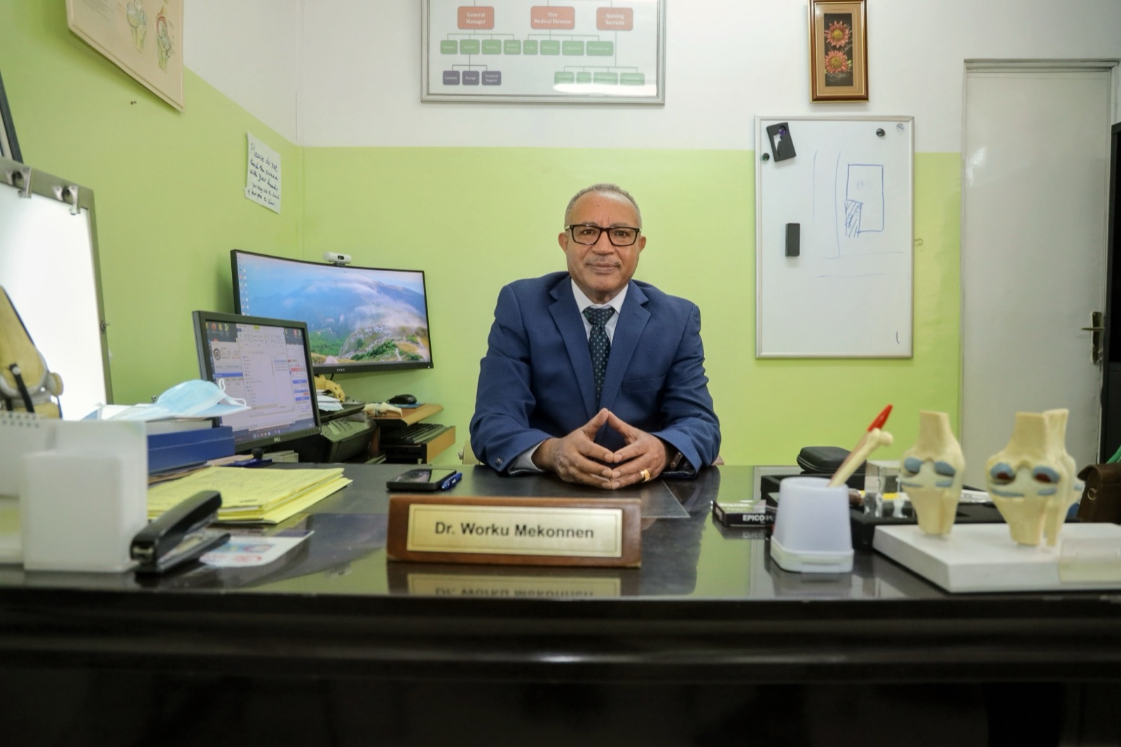 Dr. Worku Mekonnen Bogale, Medical Director, at his desk at Yordanos Hospital